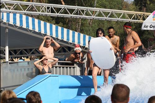 Katy Perry talks with a group of her friends after spending the afternoon at Raging Waters in San Dimas, California on August 12, 2012