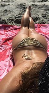 Anonymous in a bikini taking a selfie and - ass