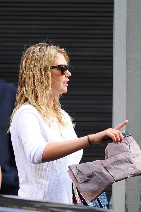 Kate Upton on her phone in New York City on June 21, 2013