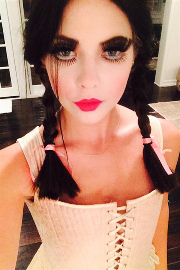 Ashley Benson dressed up as a doll for Halloween