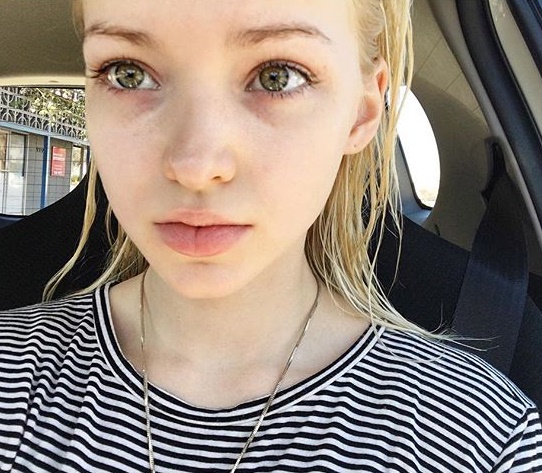 Dove Cameron taking a selfie