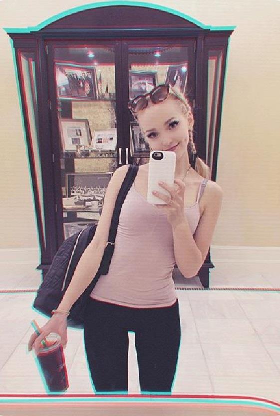 Dove Cameron taking a selfie