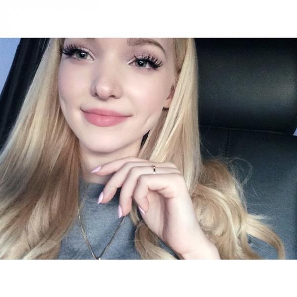 Dove Cameron taking a selfie