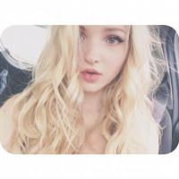 Dove Cameron taking a selfie