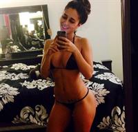 Tianna Gregory in a bikini taking a selfie