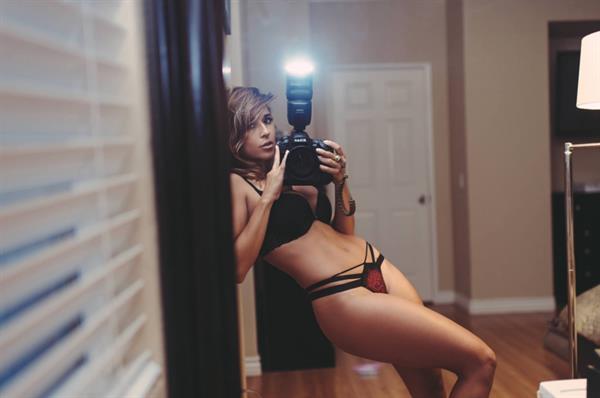 Tianna Gregory in a bikini taking a selfie