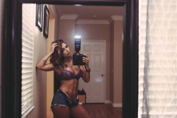 Tianna Gregory in a bikini taking a selfie