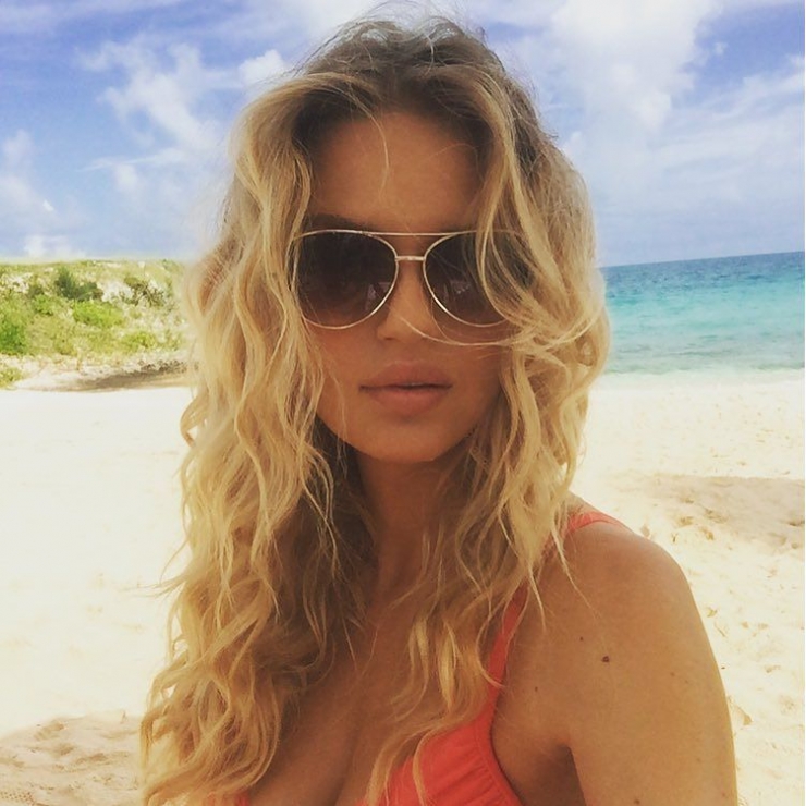 Rachel Mortenson in a bikini taking a selfie