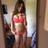 Angie Varona in a bikini taking a selfie