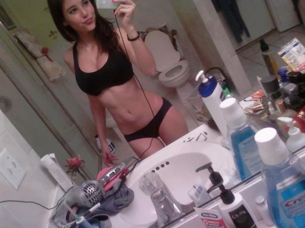 Angie Varona in a bikini taking a selfie