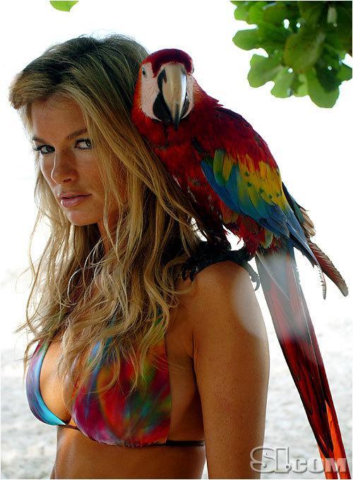 Marisa Miller with a parrot for Sports Illustrated