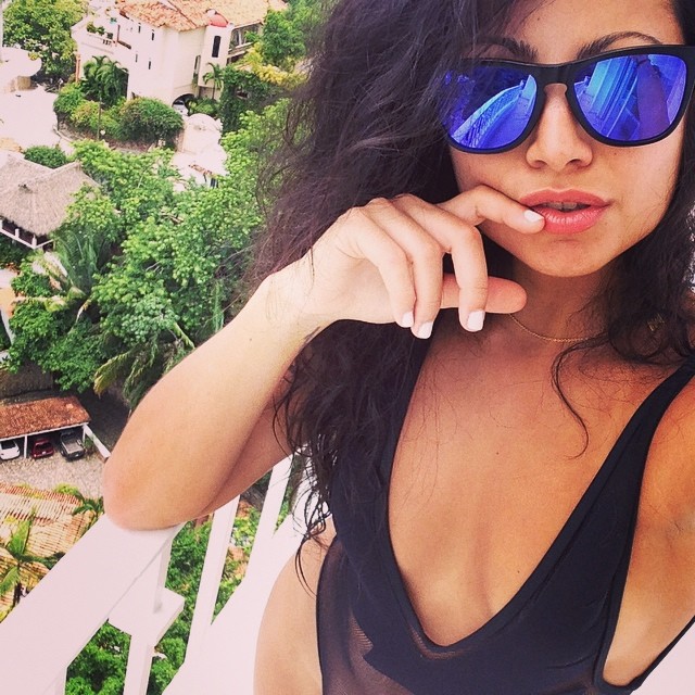 Mónica Alvarez in a bikini taking a selfie