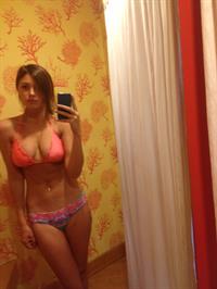 Aly Michalka in a bikini taking a selfie