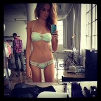 Bridget Malcolm in a bikini taking a selfie