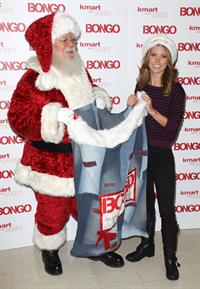 Audrina Patridge poses with Santa Claus
