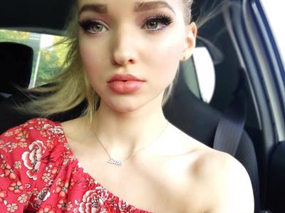 Dove Cameron taking a selfie