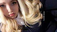Dove Cameron taking a selfie
