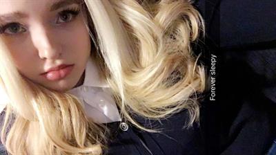 Dove Cameron taking a selfie