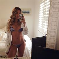 Cindy Prado in a bikini taking a selfie