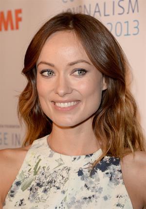 Olivia Wilde debuts her small baby bump while attending the 2013 International Women’s Media Foundation’s Courage in Journalism Awards at the Beverly Hills Hotel on Tuesday (October 29, 2013) in Beverly Hills, Calif.