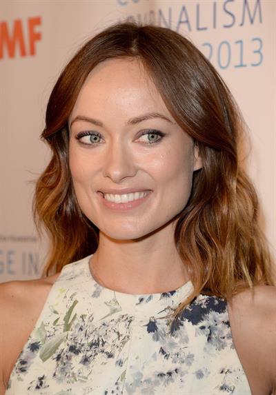 Olivia Wilde debuts her small baby bump while attending the 2013 International Women’s Media Foundation’s Courage in Journalism Awards at the Beverly Hills Hotel on Tuesday (October 29, 2013) in Beverly Hills, Calif.