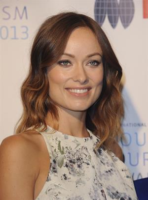 Olivia Wilde debuts her small baby bump while attending the 2013 International Women’s Media Foundation’s Courage in Journalism Awards at the Beverly Hills Hotel on Tuesday (October 29, 2013) in Beverly Hills, Calif.