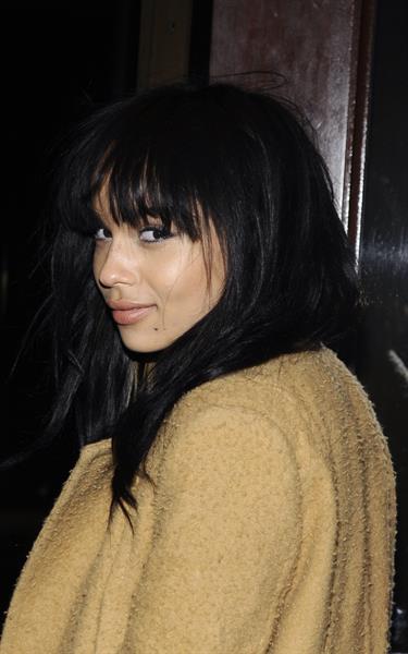 Zoe Kravitz in a long jacket and high heels