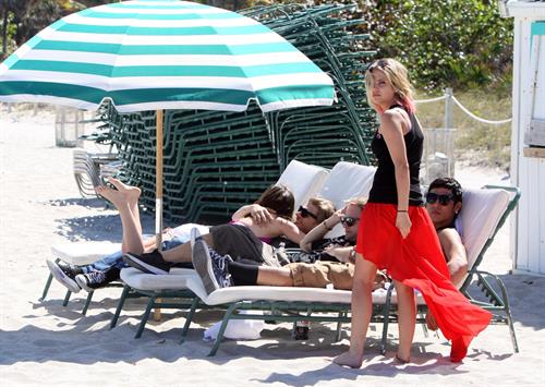 Lucy Hale and Ashley Benson photoshoot at the Bondo Bikini Shack on Miami Beach on March 24, 2012