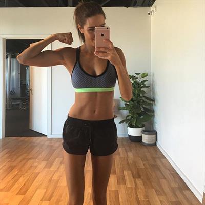 Kayla Itsines taking a selfie