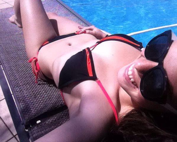 Alexis Young in a bikini taking a selfie
