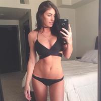 Christy May in a bikini taking a selfie