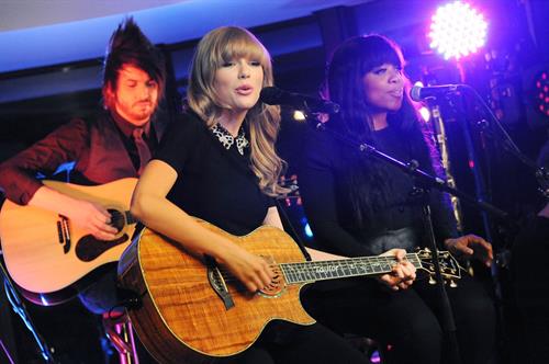 Taylor Swift performs at a private concert for NRJ on a barge on The Seine January 28, 2013 
