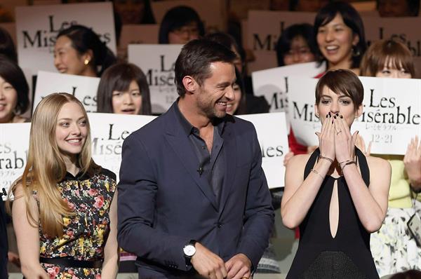 Anne Hathaway poses for photographers during an event to promote their latest movie 'Les Miserables' in Tokyo