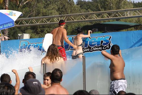 Katy Perry talks with a group of her friends after spending the afternoon at Raging Waters in San Dimas, California on August 12, 2012