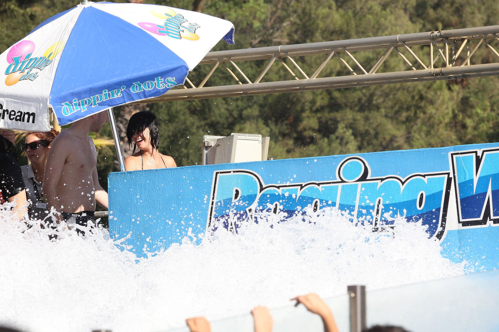 Katy Perry talks with a group of her friends after spending the afternoon at Raging Waters in San Dimas, California on August 12, 2012