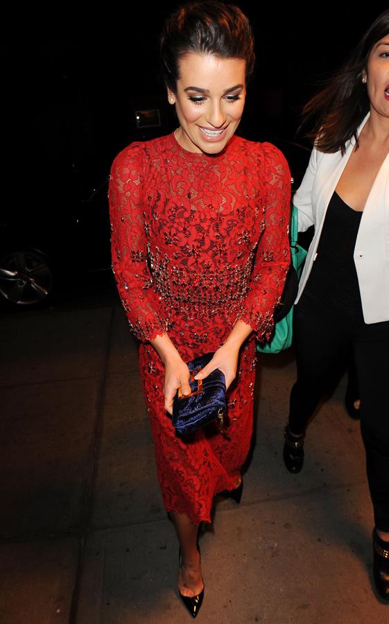 Lea Michele outside in a red dress at night