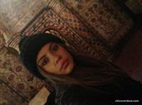 Xenia Tchoumitcheva taking a selfie