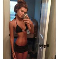 Emily Pemberton in a bikini taking a selfie