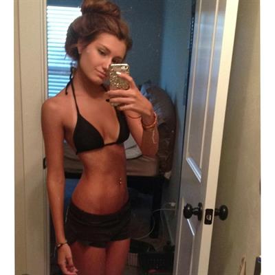 Emily Pemberton in a bikini taking a selfie