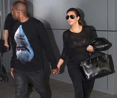 Kim Kardashian and Kanye West JFK airport in New York - 09 August 2012 