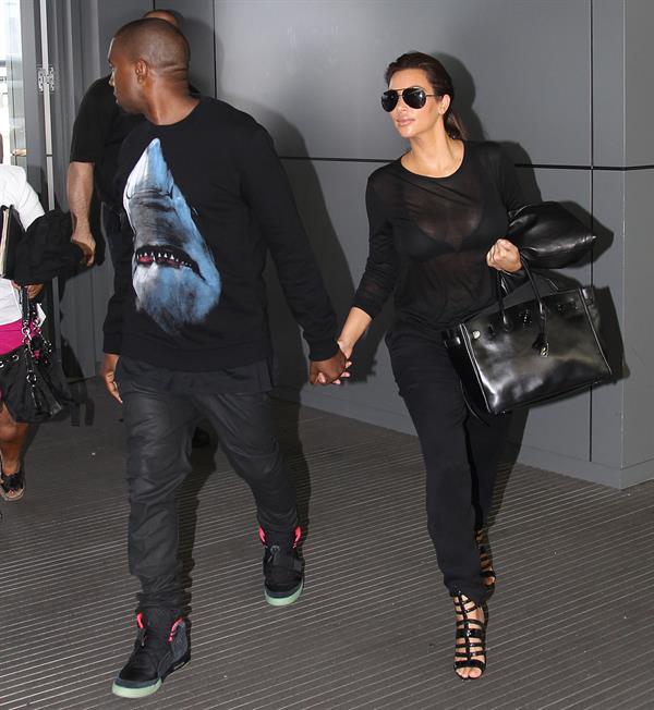 Kim Kardashian and Kanye West JFK airport in New York - 09 August 2012 