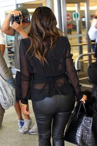 Kim Kardashian arriving at airport in Miami 10/17/12 
