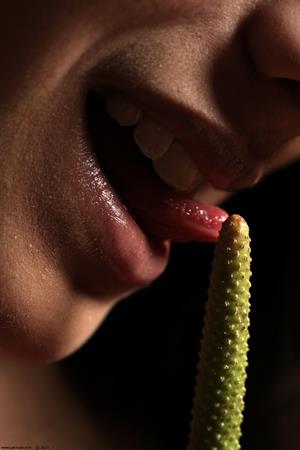 Belinda A nude poses with a flower