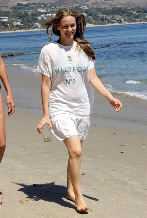 Alicia Silverstone walking on the beach in Malibu 