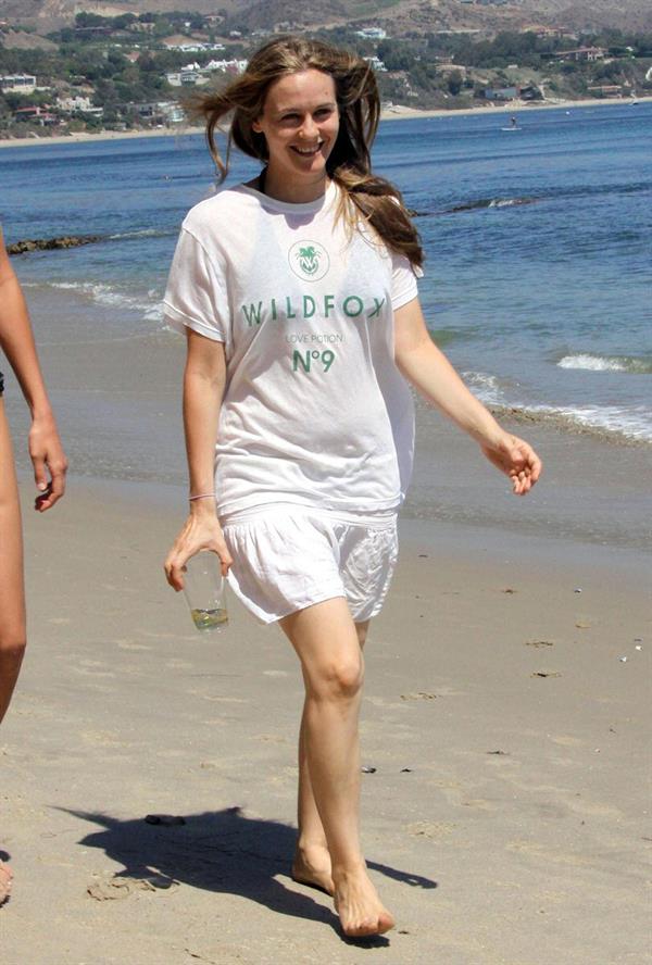 Alicia Silverstone walking on the beach in Malibu 