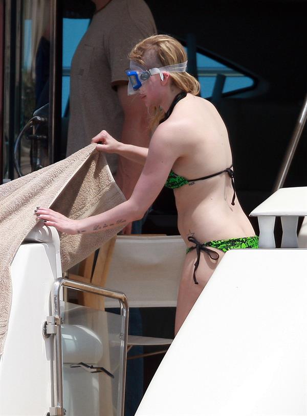 Avril Lavigne in a green bikini in Cabo, Mexico on July 27, 2012