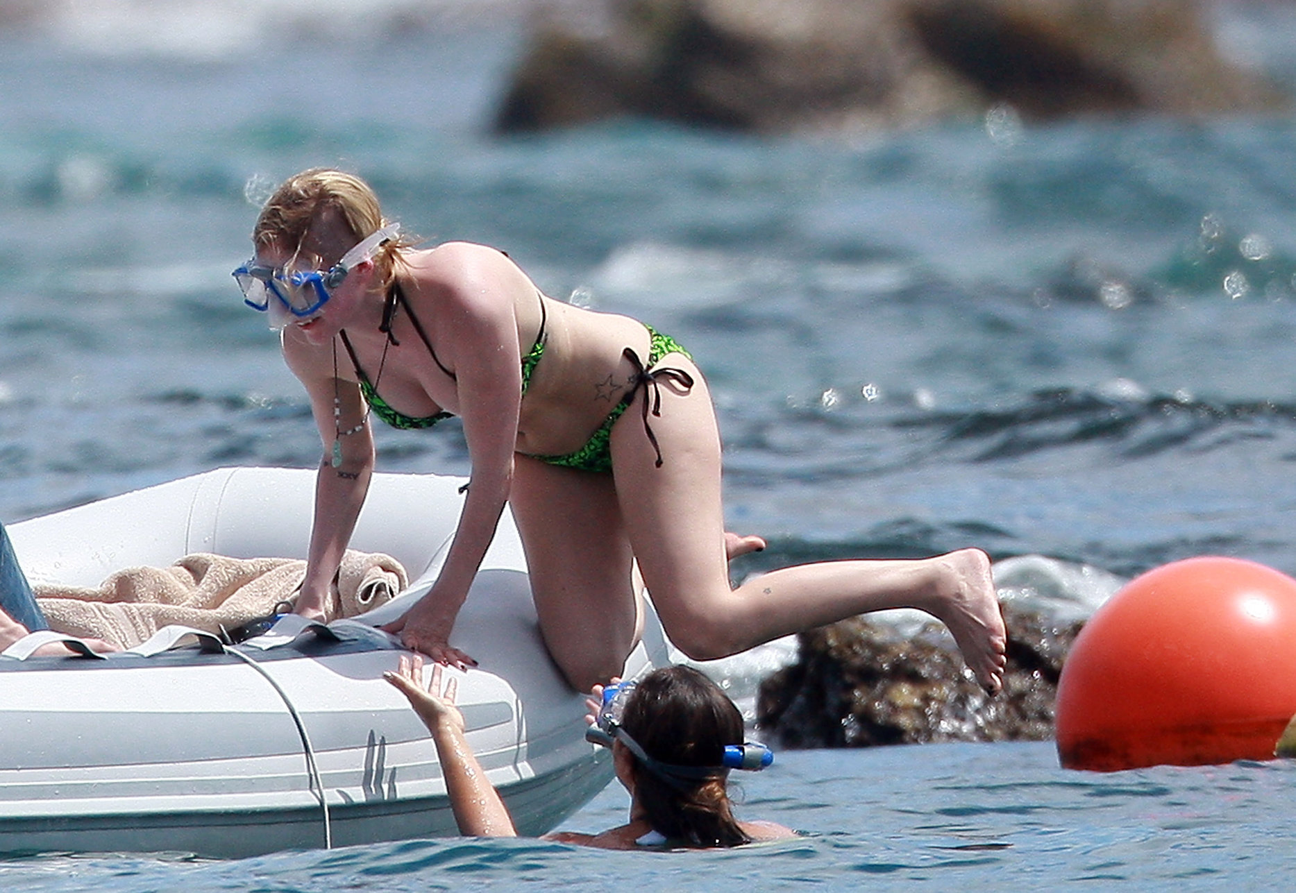 Avril Lavigne in a green bikini in Cabo, Mexico on July 27, 2012