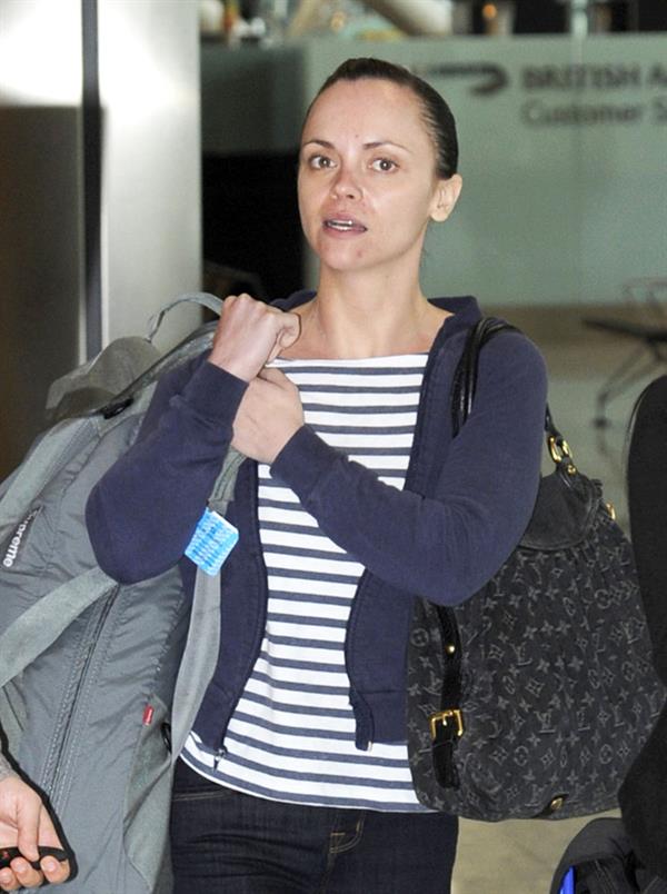 Christina Ricci With her boyfriend fly out of Heathrow Airport in London to NY - June 12, 2012