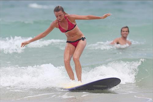Daniela Hantuchova bikini beach surfing candids in Brisbane, Australia, December 26, 2012 
