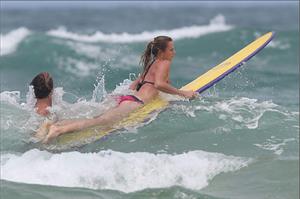 Daniela Hantuchova bikini beach surfing candids in Brisbane, Australia, December 26, 2012 